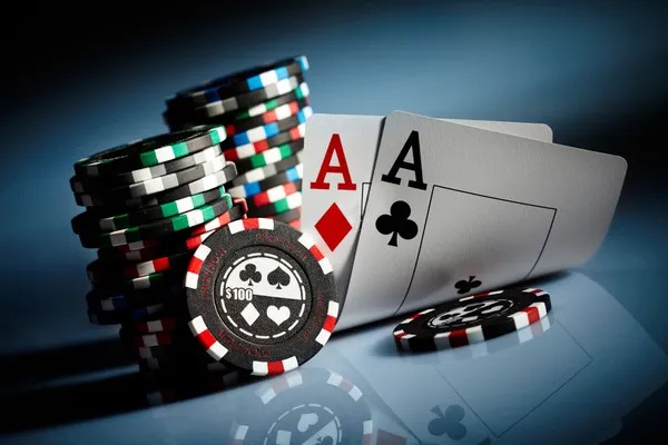 Roulette wheel spinning with betting chips on numbered layout